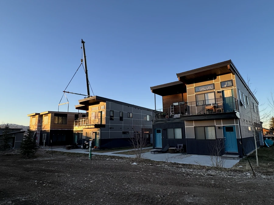 Crane setting an upper module at Westgroup employee housing in Victor, Idaho
