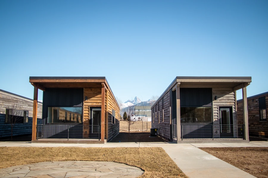 Two Ridgeline homes facing a shared walkway at Tributary in Driggs, Idaho