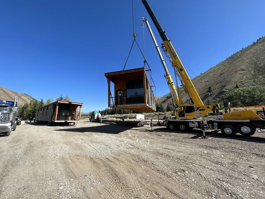 Crane setting a Ridgeline module for firefighter housing in Sun Valley, Idaho