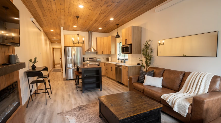 Living room and kitchen with a wood ceiling in an Island Park, Idaho modular rental