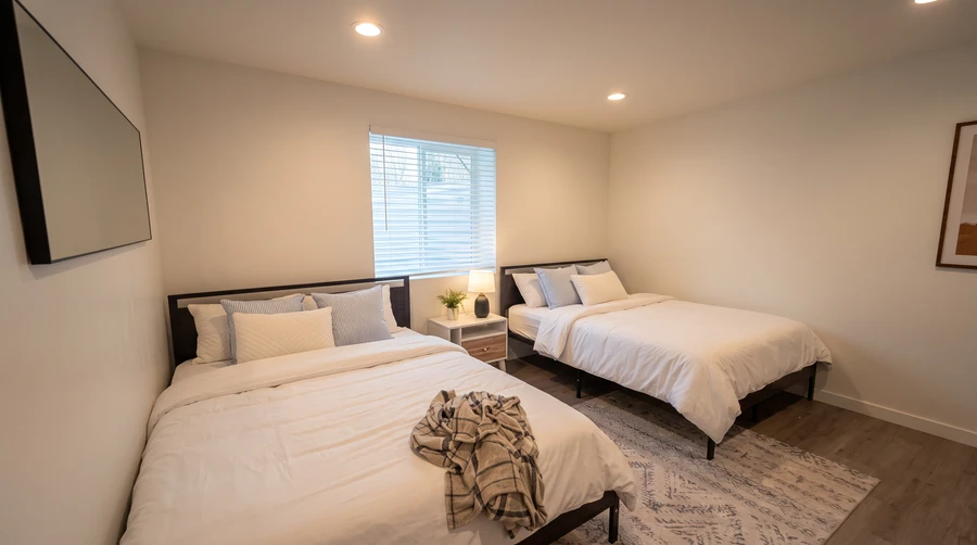 Bedroom with two beds in a modular rental at Island Park, Idaho